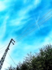Low angle view of crane against sky