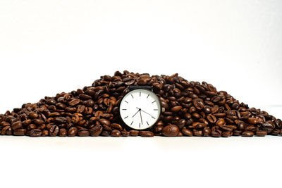 Close-up of coffee beans against white background