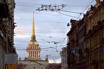 Low angle view of admiralty building seen through cables