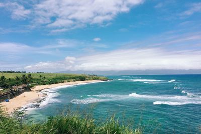 Scenic view of sea against cloudy sky