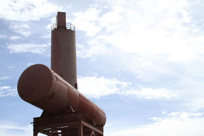 Low angle view of old factory against sky