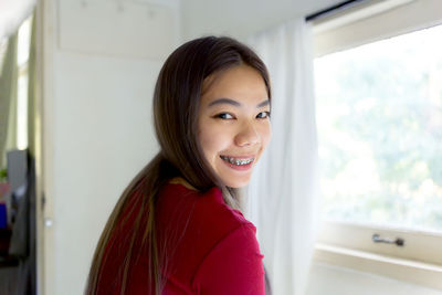 Portrait of smiling young woman