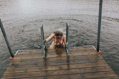 Woman leaving lake