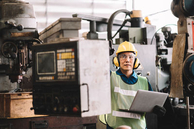 Full length of man working at construction site