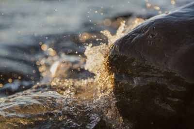 Close-up of water splashing on rocks