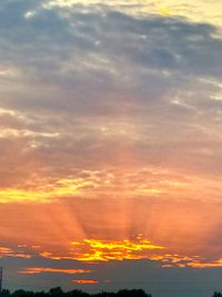 Low angle view of dramatic sky during sunset