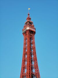 Low angle view of tower against blue sky