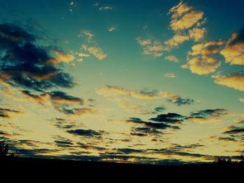 Scenic view of dramatic sky at sunset