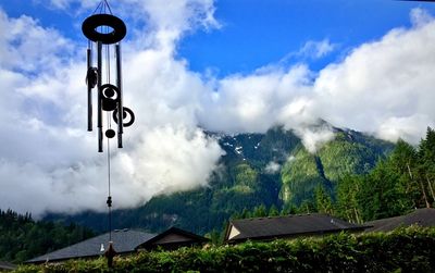 View of trees and mountains against sky