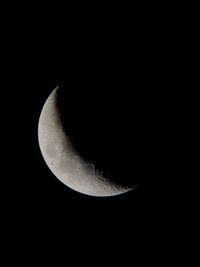 Low angle view of moon in sky at night