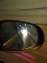 Reflection of car on side-view mirror