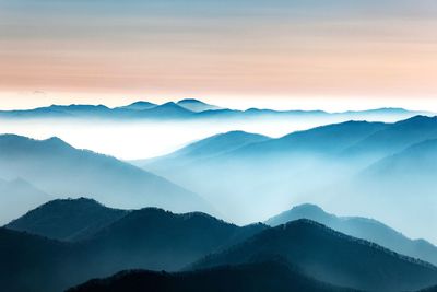 Scenic view of mountains against sky during sunset