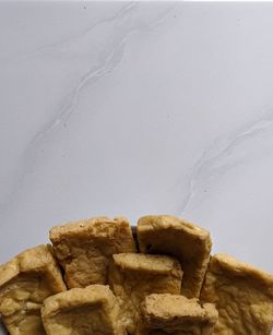 Close-up of bread against white background