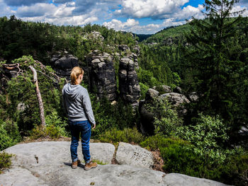 Young woman standing on mountain