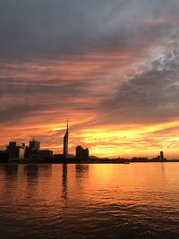 Scenic view of sea against orange sky