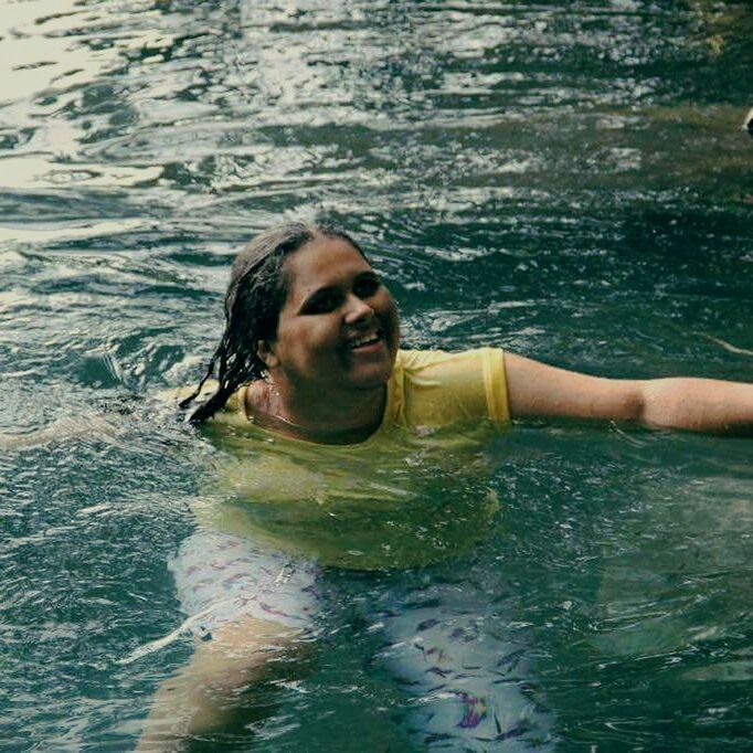 water, young adult, person, lifestyles, looking at camera, portrait, leisure activity, young women, waterfront, front view, smiling, happiness, wet, rippled, vacations, swimming, shirtless