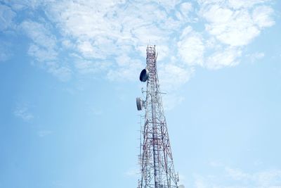 Low angle view of communications tower against sky