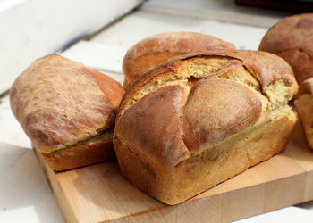 High angle view of bread on cutting board