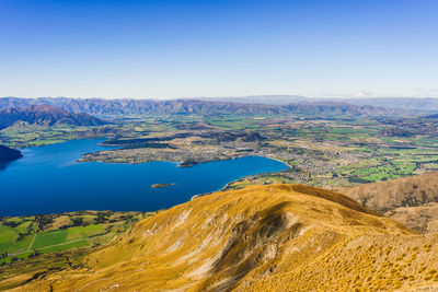 Scenic view of landscape against blue sky