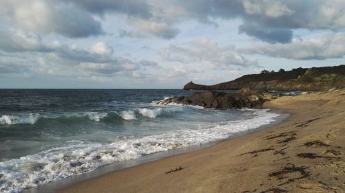 Scenic view of beach against sky