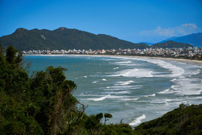 Scenic view of sea against blue sky