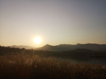 Scenic view of landscape against sky during sunset