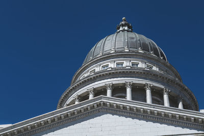 Low angle view of building against clear blue sky