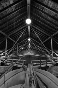 Low angle view of illuminated lights on ceiling