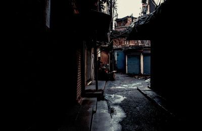 Alley amidst buildings in city
