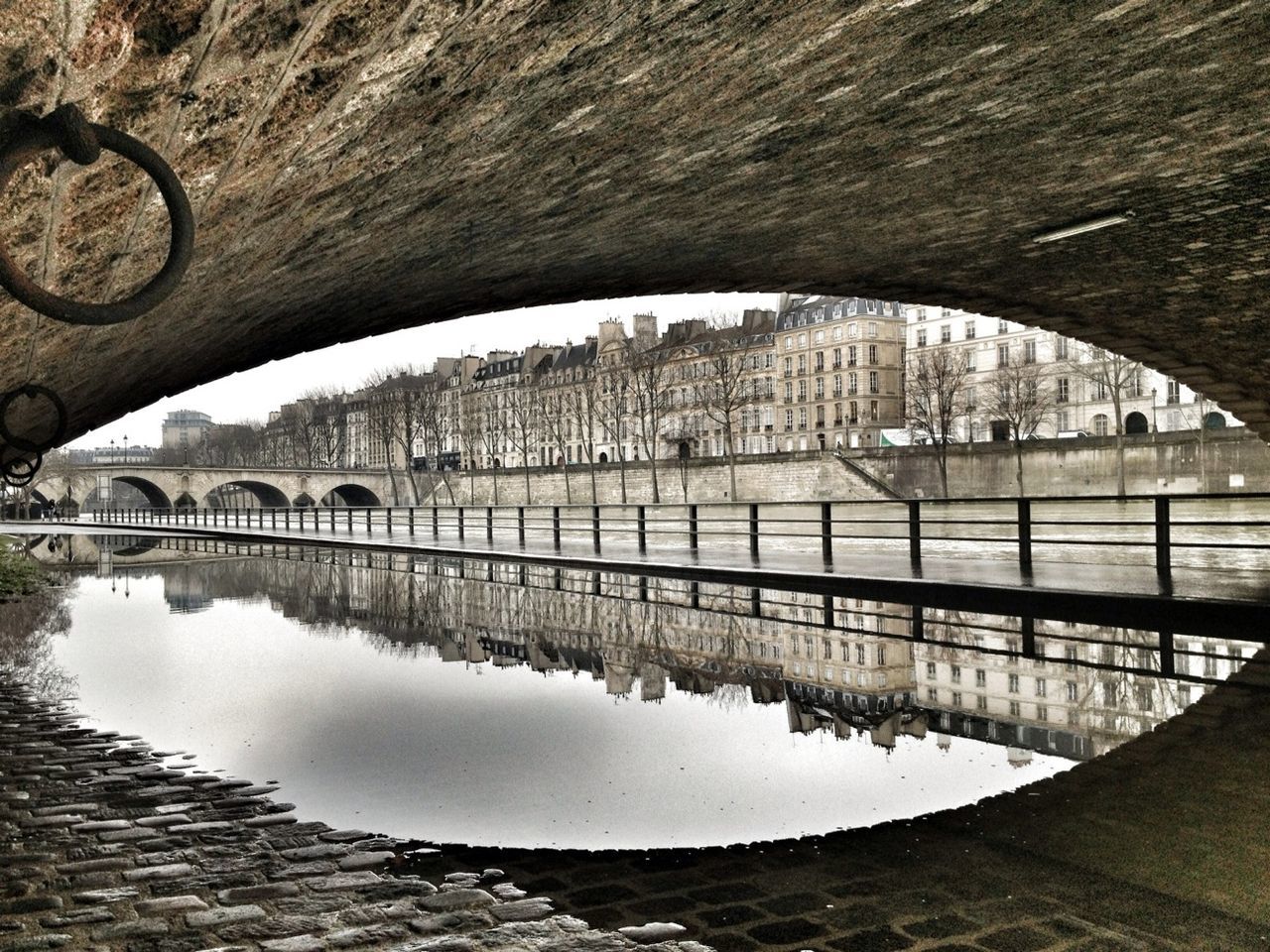 architecture, built structure, arch, building exterior, connection, arch bridge, bridge - man made structure, river, bridge, reflection, city, arched, water, transportation, engineering, day, outdoors, archway, sky, travel destinations