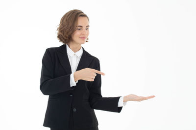 Mid adult woman standing against white background