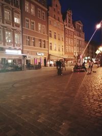 People on street at night