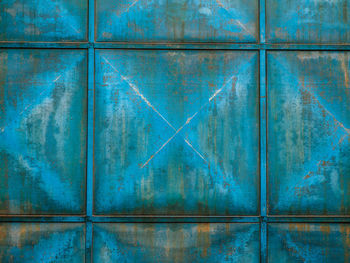 Full frame shot of weathered blue metal