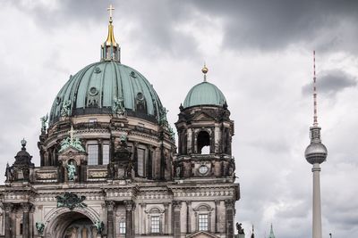 Low angle view of cathedral against cloudy sky