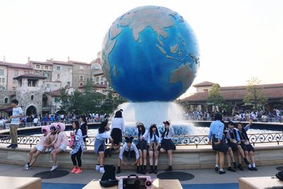 People in city against clear sky