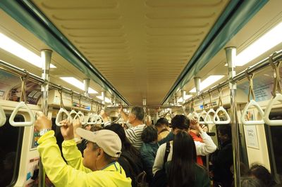 High angle view of passengers in train