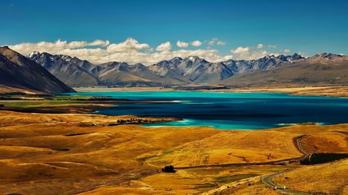 Scenic view of lake and mountains against sky