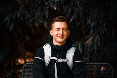 Portrait of young man standing outdoors