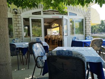 Empty chairs and tables in cafe