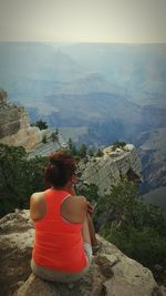 Rear view of woman looking at mountains