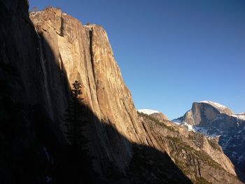 Low angle view of rock formations against sky