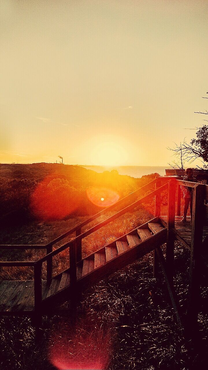 SCENIC VIEW OF LANDSCAPE AGAINST SKY DURING SUNSET