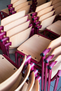 High angle view of multi colored chairs on table