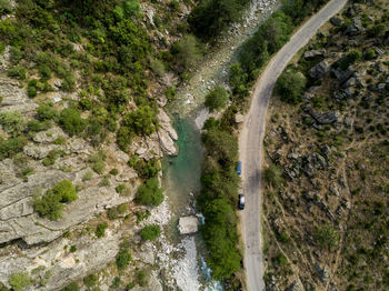 High angle view of winding road in forest