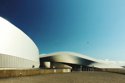 Low angle view of built structure against clear blue sky