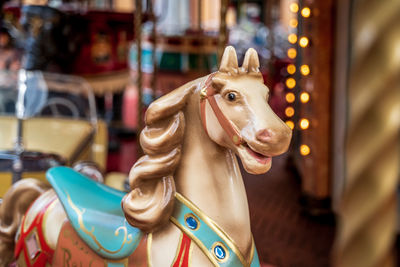 Close-up of carousel horse in amusement park