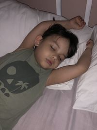 Boy sleeping on bed