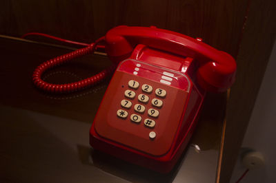 High angle view of telephone on table