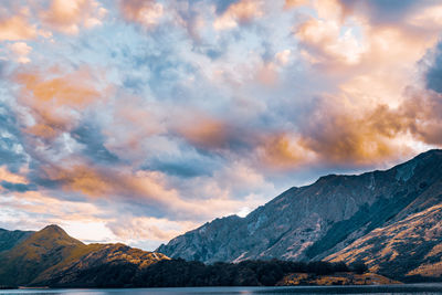 Scenic view of snowcapped mountains against sky during sunset