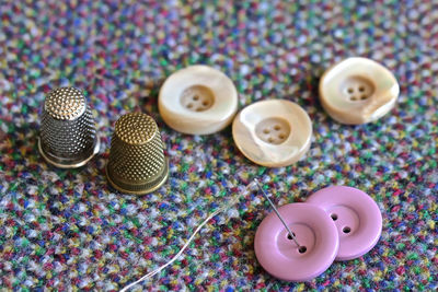 High angle view of various buttons on table